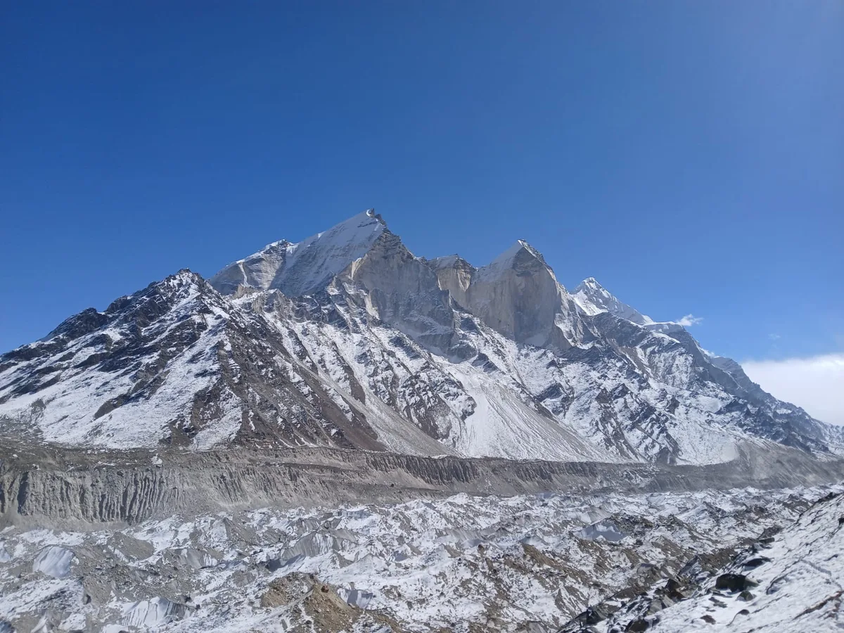 Bhagirathi Massif (I, II, III) Towering Above Glacier Moraine